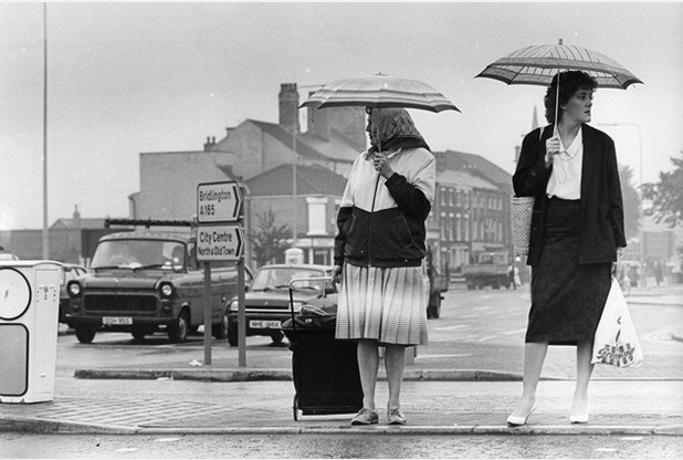 FLASHBACK HDM ARCHIVE LIBRARY IMAGES weekly daily Images of Freetown Way in Hull. Dated 22nd August 1986 - pedestrians and motorists alike get used to Hull's newest road. keywords - roads traffic access 1980's car cars wet weather rain umbrella umbrellas rainy pouring generic brolly brollie